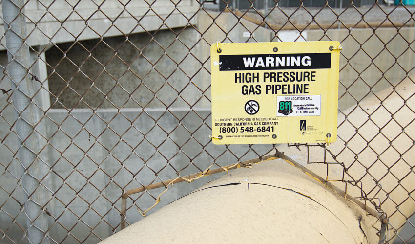 warning sign near gas pipeline