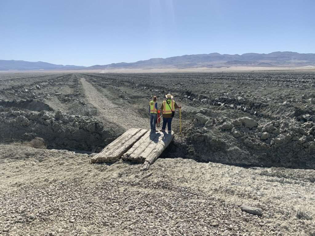 Photo of lake with employees